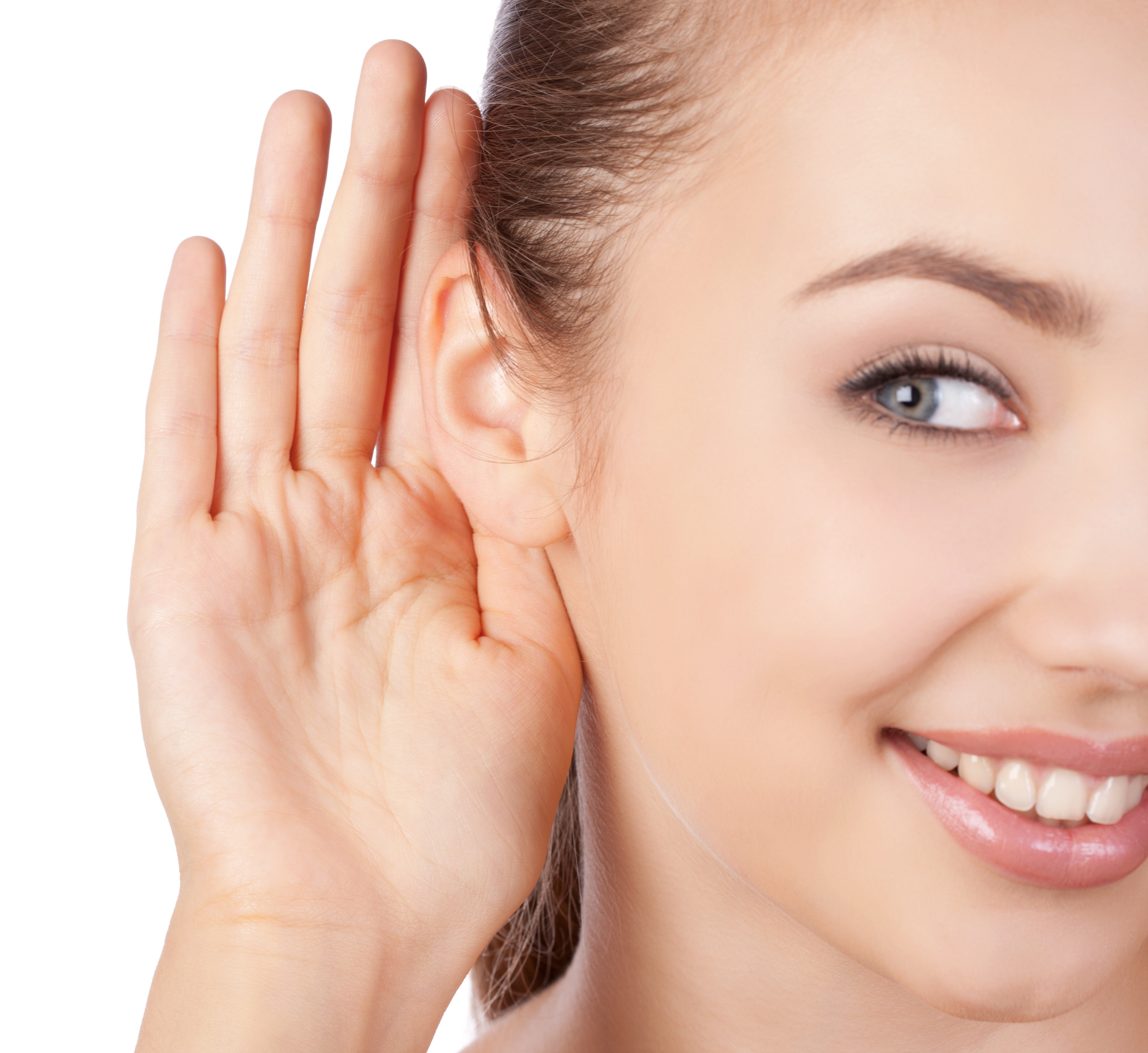 Young woman listening with a hand to her ear young woman listening